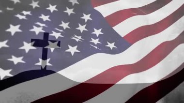 Başlangıçta yarı şeffaf Amerikan bayrağı tepe haçı üzerinde dalgalanırken inanç ve vatanseverliği gösteriyordu. Vatanseverlik, maneviyat, dayanıklılık, sembolizm, bağlılık, miras, birlik