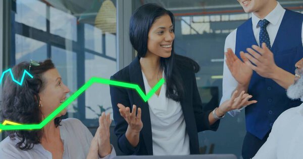 Businesswoman in blazer presenting in office meeting room, with laptop and neon-green blue graphs. Collaboration, leadership, teamwork, professional, analytics, innovation, corporate