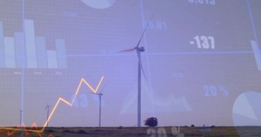 Alacakaranlıkta, en büyük rüzgar türbini dönerken ikili trend çizgileri yükselip alçalıyor. Yenilenebilir, sürdürülebilirlik, veri, analitik, teknoloji, enerji, çevre