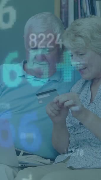 Animation of numbers changing and statistics recording over senior couple shopping online. global business and finance concept digitally generated video.