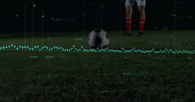 Sitting soccer ball on grass field at night, with green data visualization overlay. Athletic, performance, analytics, motion, competition, outdoor, dynamic