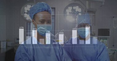 Analyzing data graph overlay surgeons wearing scrubs in surgical suite, with lights and monitors. Medical, healthcare, analytics, innovation, collaboration, clinical, diagnostic