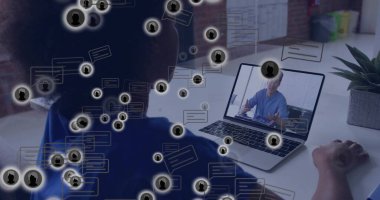 Conducting remote meeting adult Black woman at white home office desk using laptop and succulent. Collaboration, technology, communication, innovation, professional, modern, workspace