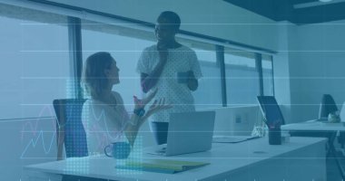 Talking office colleagues gesturing while listening in open-plan office, with laptop coffee mug. Collaboration, teamwork, professional, business, workspace, communication, productivity