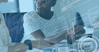 Colleagues in blouses analyzing printed documents and charts in meeting room, with coffee and phone. Collaboration, dataanalysis, professionalism, moderndesign, teamwork, corporate, businesswomen