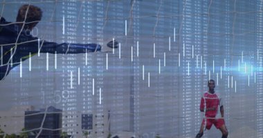 Diving goalkeeper stretching toward soccer ball near goal frame on pitch, with financial overlays. Athletics, analytics, competition, momentum, strategy, sporty, outdoor