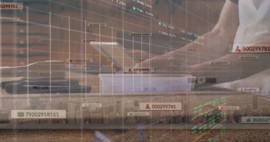 Asian man wearing white shirt analyzing virtual financial charts on laptop at desk, copy space. Technology, productivity, innovation, data analysis, digital workspace, professional, modern