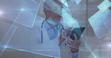 Doctor wearing lab coat tapping hologram in clinic, holding tablet, stethoscope and surgical mask. Medical, technology, innovation, healthcare, digital, futuristic, professional