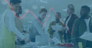 Collaborating team reviewing sketches and fabric samples at design studio with laptop, yellow apron. Creative, teamwork, innovation, fashion, brainstorming, professional, vibrant
