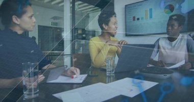 Speaking woman in yellow sweater leading meeting in modern glass conference room with laptop charts. Collaboration, teamwork, business, strategy, communication, presentation, corporate