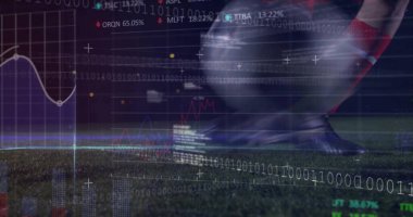 Striking cleated foot wearing red socks sending soccer ball on floodlit turf, with data overlays. Athletic, performance, digital, technology, movement, stadium, competition