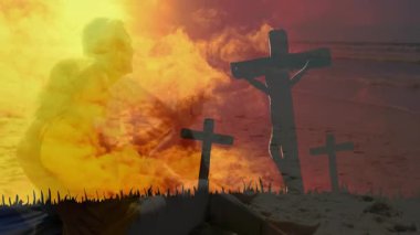 Güneş ufuk çizgisine yaklaşan çift, haçlar önünde eğilip eğitime yansımayı teşvik ediyor. İnanç, maneviyat, düşünce, bağlılık, sükunet, dinginlik, saygı.