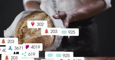 Baker ekmeği tutarken, sosyal medya simgeleri nişan büyümesini gösteren bir somun ekmeği kaplıyor. Sanatçılık, zanaat, kutlama, dijital, nüfuz, promosyon, yaratıcı