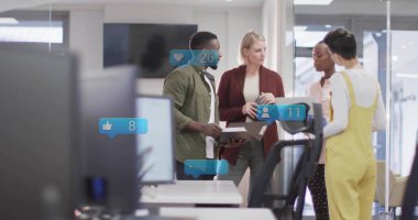 Collaborating colleagues gathering around treadmill desk holding binder in office with social icons. Collaboration, productivity, innovation, modernity, teamwork, ergonomic, connectivity