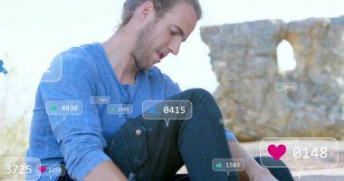Leaning man studying notification overlays on rocky outcrop by stone arch, with floating icons. Outdoor, nature, adventure, technology, communication, exploration, rugged