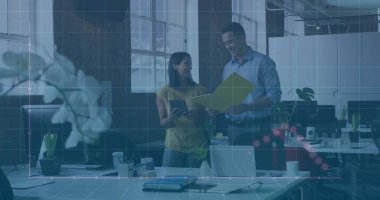 Standing colleagues wearing businesswear reviewing data in open-plan office, with tablet and folder. Collaboration, teamwork, innovation, productivity, modern, professional, urban