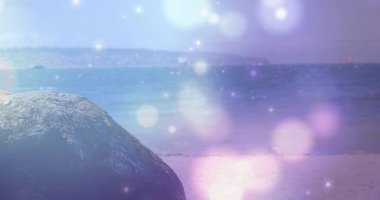 Sitting large textured boulder on sandy beach, showing coastal horizon with light orbs, copy space. Scenic, tranquil, abstract, nature, minimalist, pastel, serenity