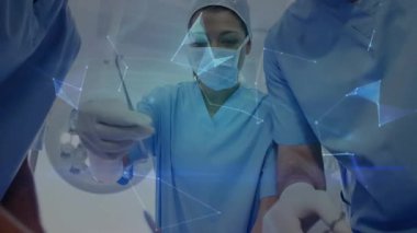 Cerrahlar aletleri ayarlayarak, tıbbi ağ yönlendirme operasyonunu tasarlayarak prosedürü başlatıyorlar. Tıbbi, yenilik, teknoloji, takım çalışması, kesinlik, sağlık, fütüristik