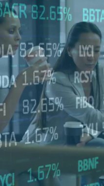 Animation of stock market over diverse business people. Global business, computing and digital interface concept digitally generated video.