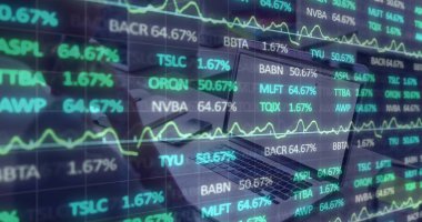 Displaying open laptop showing stock data on desk, with smartphone notebook pen and coffee cup. Technology, finance, analytics, productivity, digital, business, data visualization