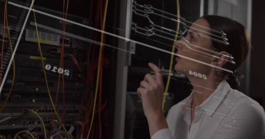 Inspecting Ethernet cables in dim server room by network engineer in white shirt, copy space. Technology, data center, cybersecurity, connectivity, innovation, digital infrastructure, network management