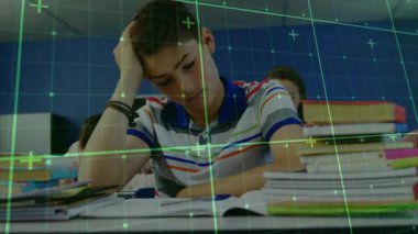 Teenage boy writing in classroom while green grid overlay scanning notebook for data analysis. Student, education, technology, learning, study, knowledge, academic