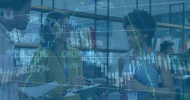 Viewing stock charts overlay in open-plan office, staff working with clipboard docs coffee lanyards. Collaboration, teamwork, corporate, business, professional, modern, productivity