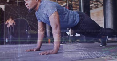 Performing push-up, man in athletic wear in gym studio, with bike, mats and graph overlays. Fitness, strength, endurance, workout, motion, industrial, modern