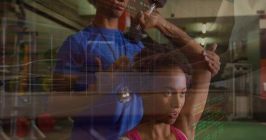 Guiding female client performing overhead arm stretching in gym weight area with rack, data overlay. Training, strength, wellness, biomechanics, motivation, performance, ergonomics