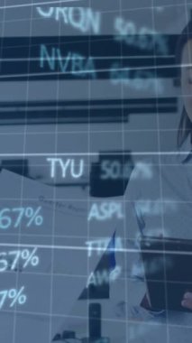 Animation of financial data processing over diverse business people in office. Global business, finances, computing and data processing concept digitally generated video.