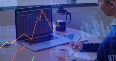 Analyzing stock chart woman taking notes at office desk, with laptop, notebook, pen, copy space. Professional, workspace, modern, digital, analysis, productivity, corporate