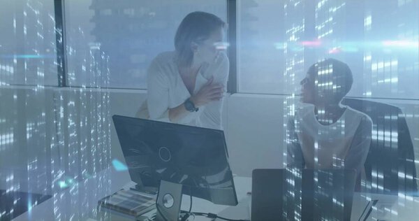 Discussing design two professional women leaning on desk using monitor at office, with swatch book. Collaboration, teamwork, coworking, innovation, technology, modernity, professional
