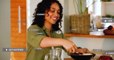 woman stirring dish with pomegranate seeds generating food content icons while man slicing turkey. Cooking, dining, social media, lifestyle, home, celebration, quality