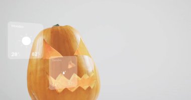 After delay weather cards sliding around carved pumpkin sweeping right showing five-day forecast. Digital interface, minimalistic, forecast, seasonal, technology, ui design, mockup