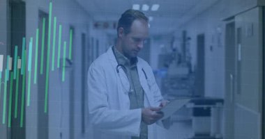 Doctor reviewing data on tablet in hospital swiping animated graphs growing and receding for review. Medical, technology, healthcare, digital, professional, diagnostic, modern