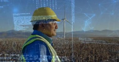 Yenilenebilir enerji takibi için rüzgar türbini etrafındaki kodları somutlaştıran mühendis. Sürdürülebilirlik, teknoloji, yenilik, otomasyon, girişim, çevre, görselleştirme