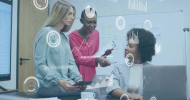 Three colleagues syncing smartphone to laptop document in business office animating chart overlays. Collaboration, teamwork, innovation, professional, communication, brainstorm, productivity