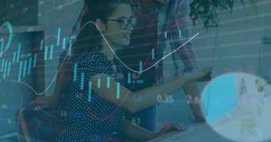 Woman in glasses and colleague reviewing charts and analyzing data in office, with dual monitors. Business, teamwork, analytics, technology, professional, collaboration, strategy