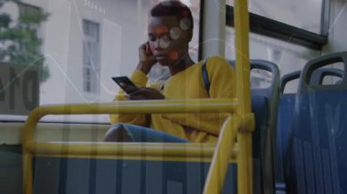 Animation of financial data over african american woman using smartphone in bus. business, finance, transport and lifestyle concept digitally generated video.
