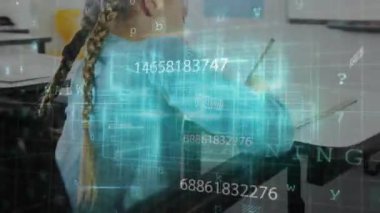 Education student writing sheet at desk, activating glowing digital grid pulsing around girl. Futuristic, innovation, technology, learning, stem, edtech, digital