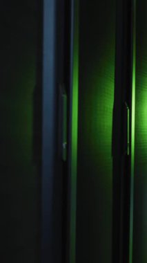 Animation of multiple graphs against server room in background. Digital composite, multiple exposure, report, business, data center, networking, technology and network server concept.