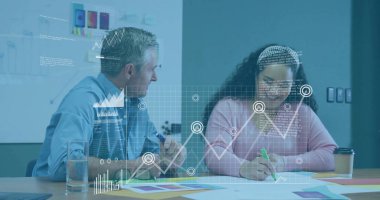 Man in blue shirt and woman in pink sweater reviewing data overlay in office meeting room. Collaboration, teamwork, data analysis, business meeting, modern office, creative process, professional environment
