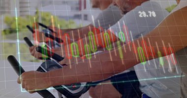 Spinning three men pedaling on spin bikes in spin studio by windows with financial chart overlay. Fitness, teamwork, vitality, innovation, health, motivation, modern