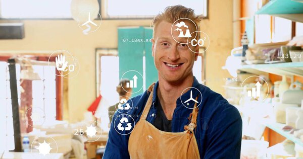 Standing artisan wearing leather apron at clay workshop, with pottery tools and eco-data icons. Craftsmanship, studio, handmade, eco-friendly, creativity, collaboration, rustic