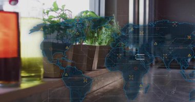 Camera panning slowly revealing world map overlay on herb pots and bottle for data visualization. Greenery, digital, connectivity, technology, sustainability, urban, abstract