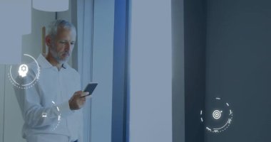 Businessman raising smartphone and initiating translucent icon interface for analyzing data. Technology, innovation, digital, analytics, strategy, workspace, screen