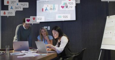 Marketing team gathering and monitoring sales metrics while member typing pulling data with icons. Collaboration, analytics, business, technology, communication, innovation, growth