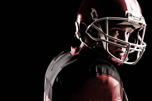 Close Up Of American Football Player In Helmet Standing Against Black Background Athlete Handsome Stock Photo Close Up Of American Football Player In Helmet Standing Against Black Background Athlete Handsome Stock Photo