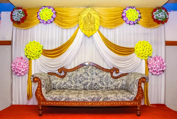 Wedding stage photography. Beautiful decoration wedding ceremony. Yellow themed indian wedding stage set up.Stage Decor for a Wedding.