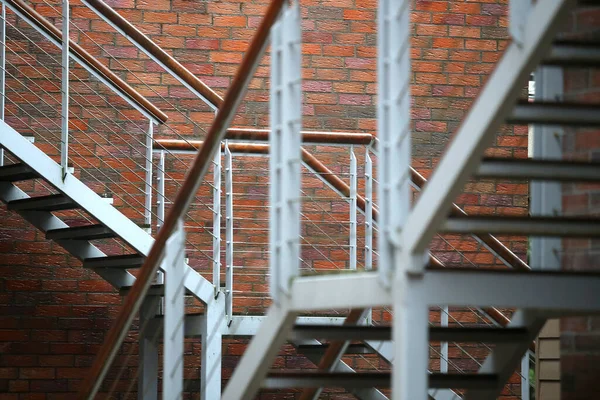 Metal stairs in a residential house loft type after the rain. Lithuania, Nid